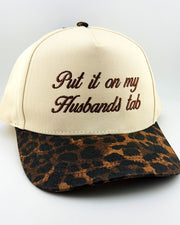 Put It On My Husband's Tab Trucker Hat